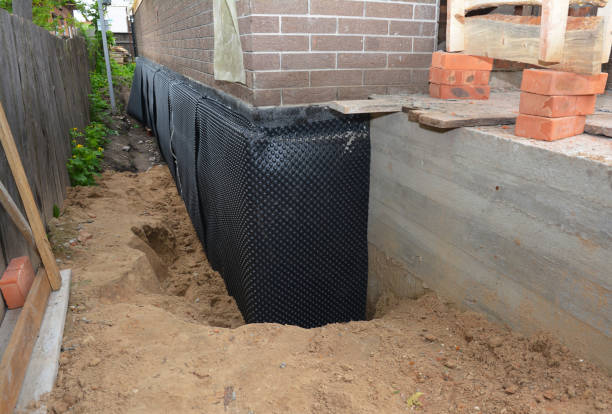 Happy homeowners after waterproofing job in Briceville